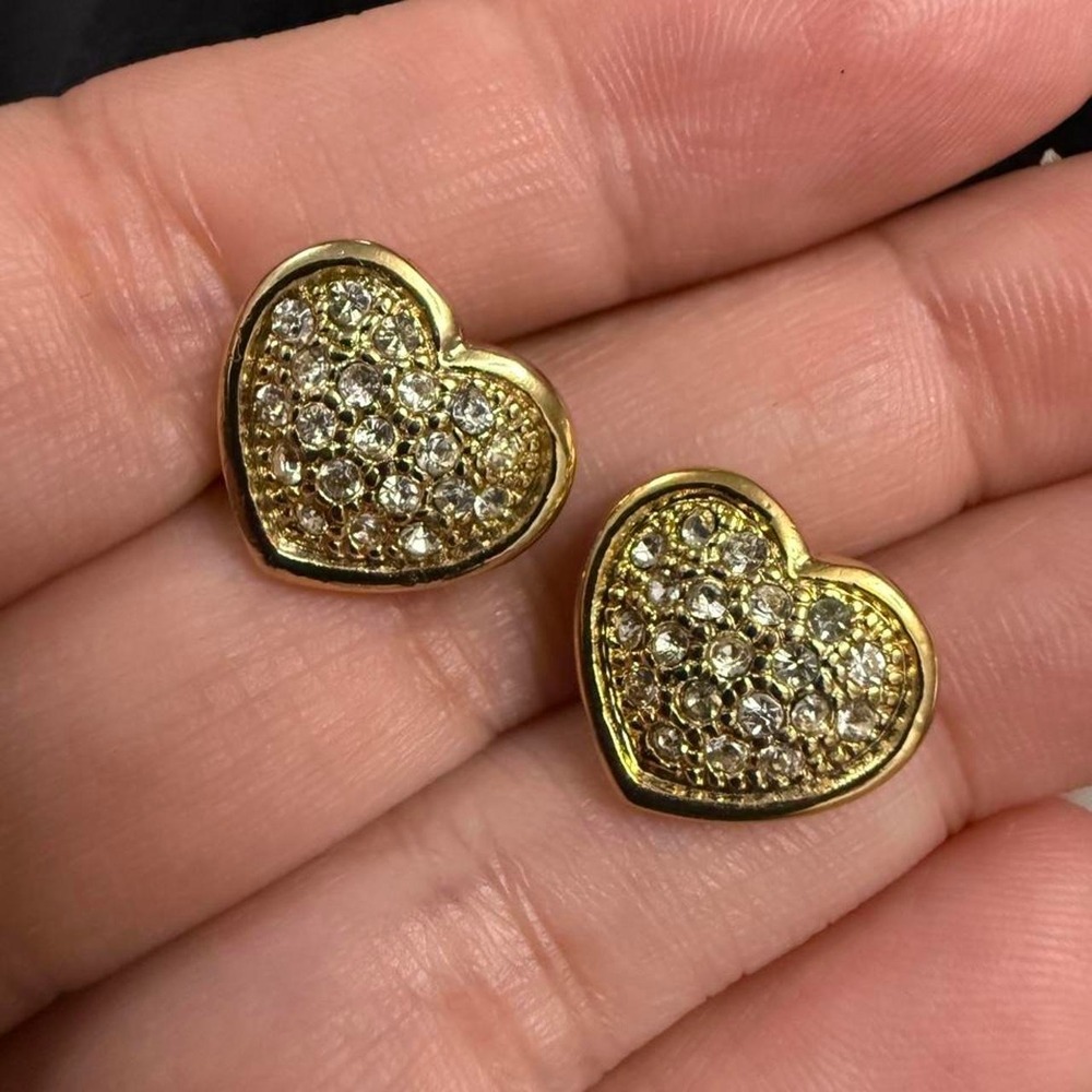 Gold tone heart earrings with diamond-like stones